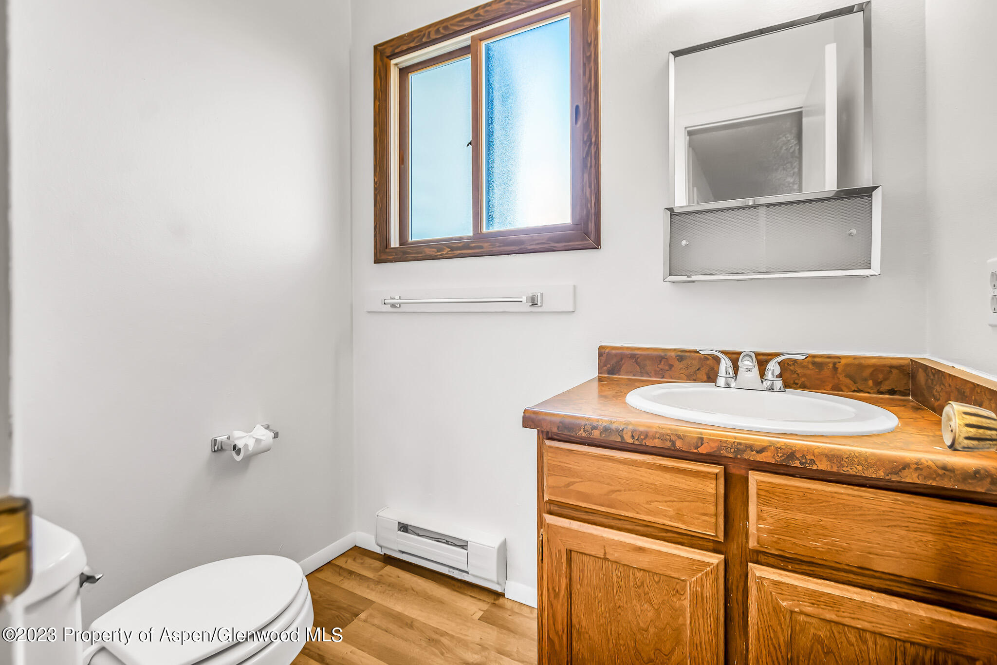 1006 Wamsley Way Rifle, CO 81650 - Photo 9 of 16 a bathroom with a granite countertop sink and a mirror