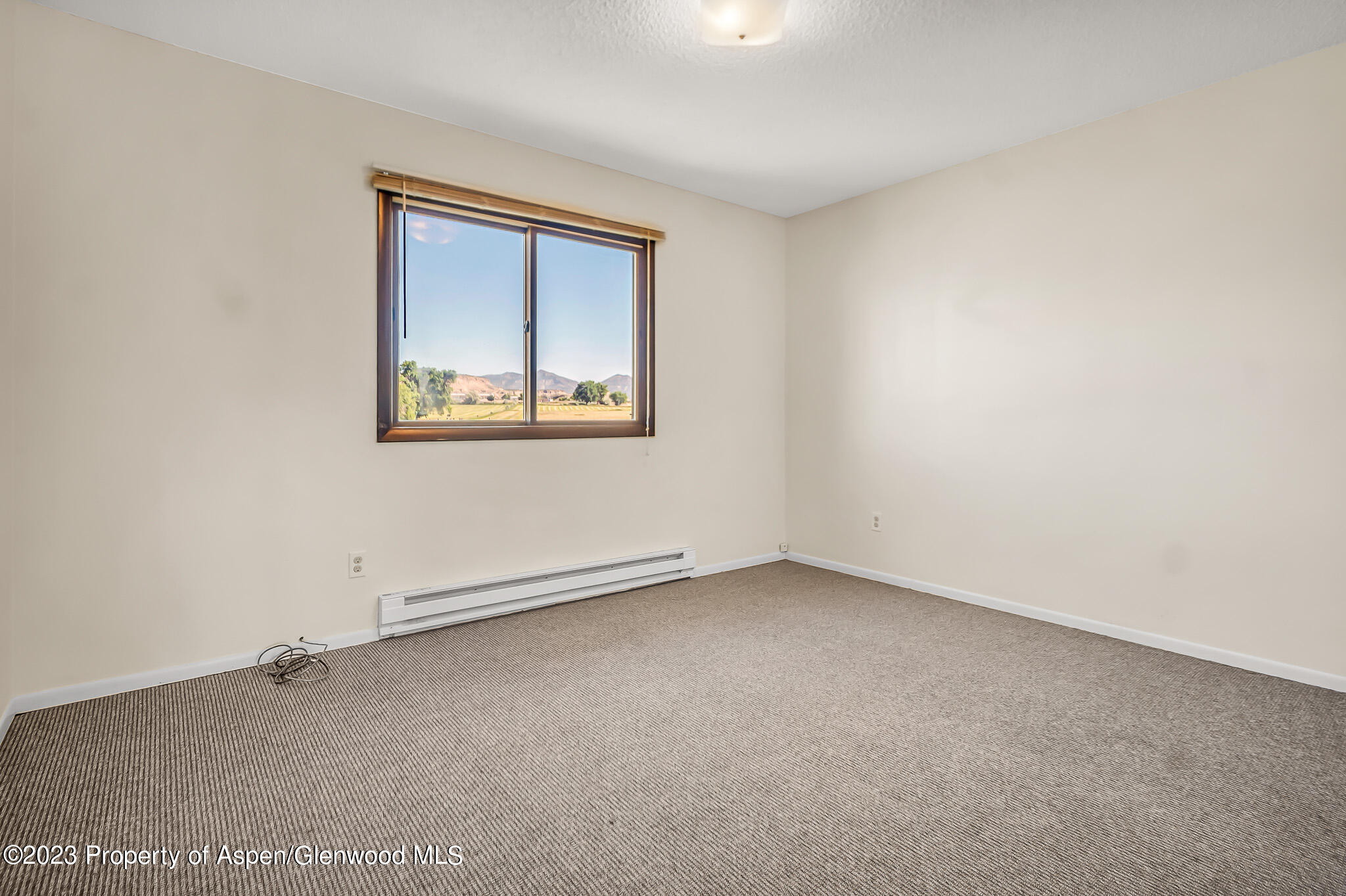 1006 Wamsley Way Rifle, CO 81650 - Photo 10 of 16 an empty room with a window