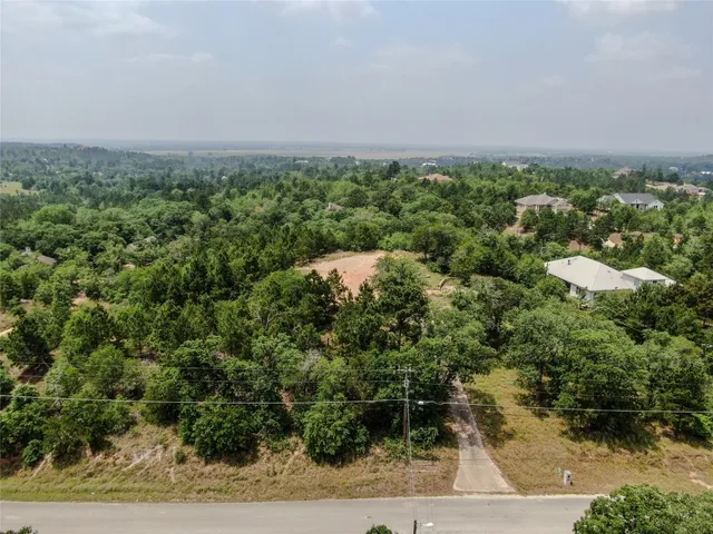 an aerial view of a city and green space