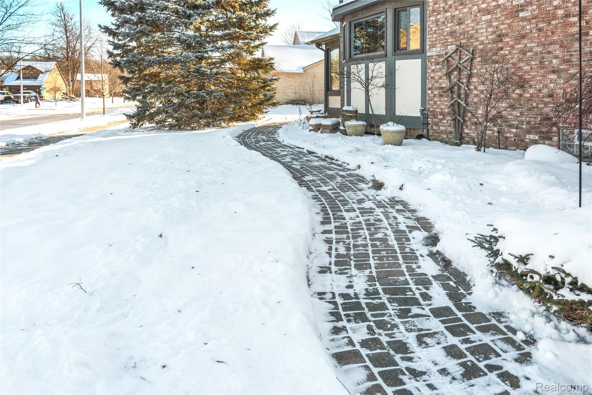 21565 Hall Road Trenton, MI 48183 - Photo 35 of 42 PAVER PATH LEADING TO BACK YARD