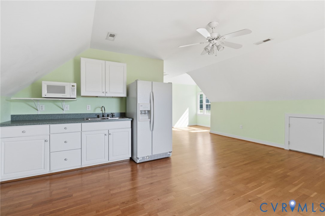 15441 Goshen Road Montpelier, VA 23192 - Photo 36 of 47 a kitchen with a refrigerator and cabinets