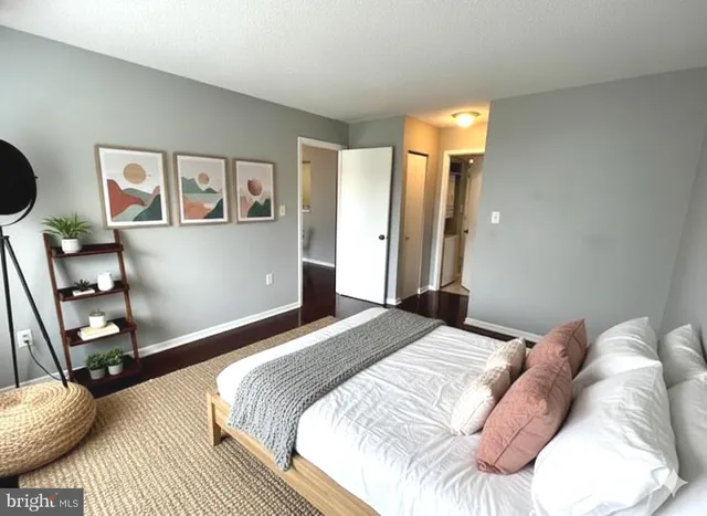 a bedroom with a bed and a mirror