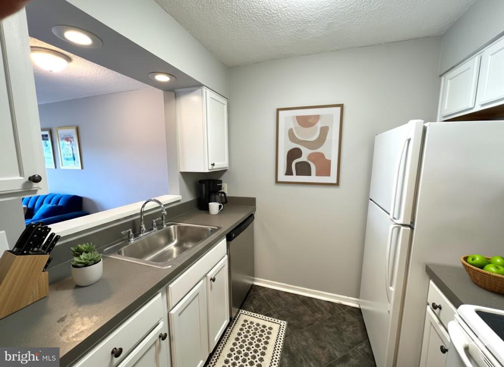 2111 Wisconsin Avenue Northwest, Unit 420 Washington, DC 20007 - Photo 7 of 28 a bathroom with a sink and a refrigerator