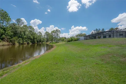 a view of a lake in middle of a forest