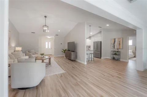 a view of a work space with furniture and wooden floor