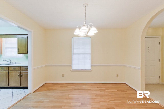 1375 Dulari Court Mobile, AL 36695 - Photo 6 of 19 Custom Chair Rail Molding & Laminate Hardwood Floors