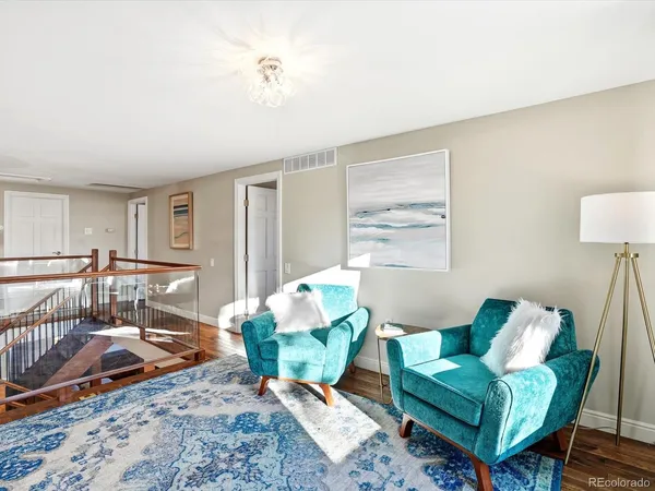 a living room with furniture and a rug