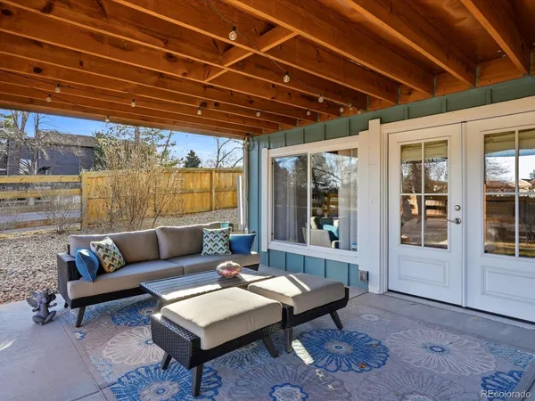 a living room with furniture a wooden floor and a table