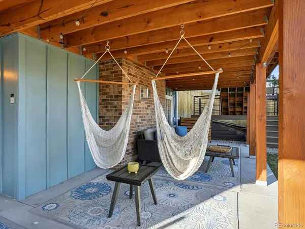 a view of a terrace with furniture and stove
