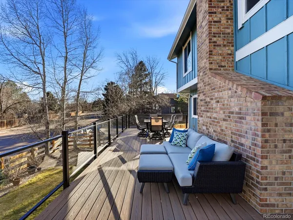 a view of a house with a swimming pool and sitting area