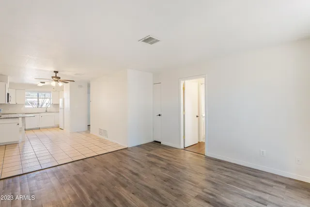 a view of a kitchen with wooden floor