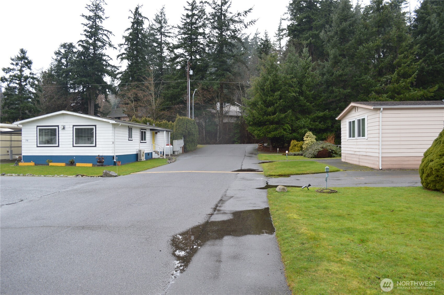 425 Chuckanut Drive North, Unit 4 Bellingham, WA 98229 - Photo 5 of 23 a view of house with swimming pool outdoor seating and yard