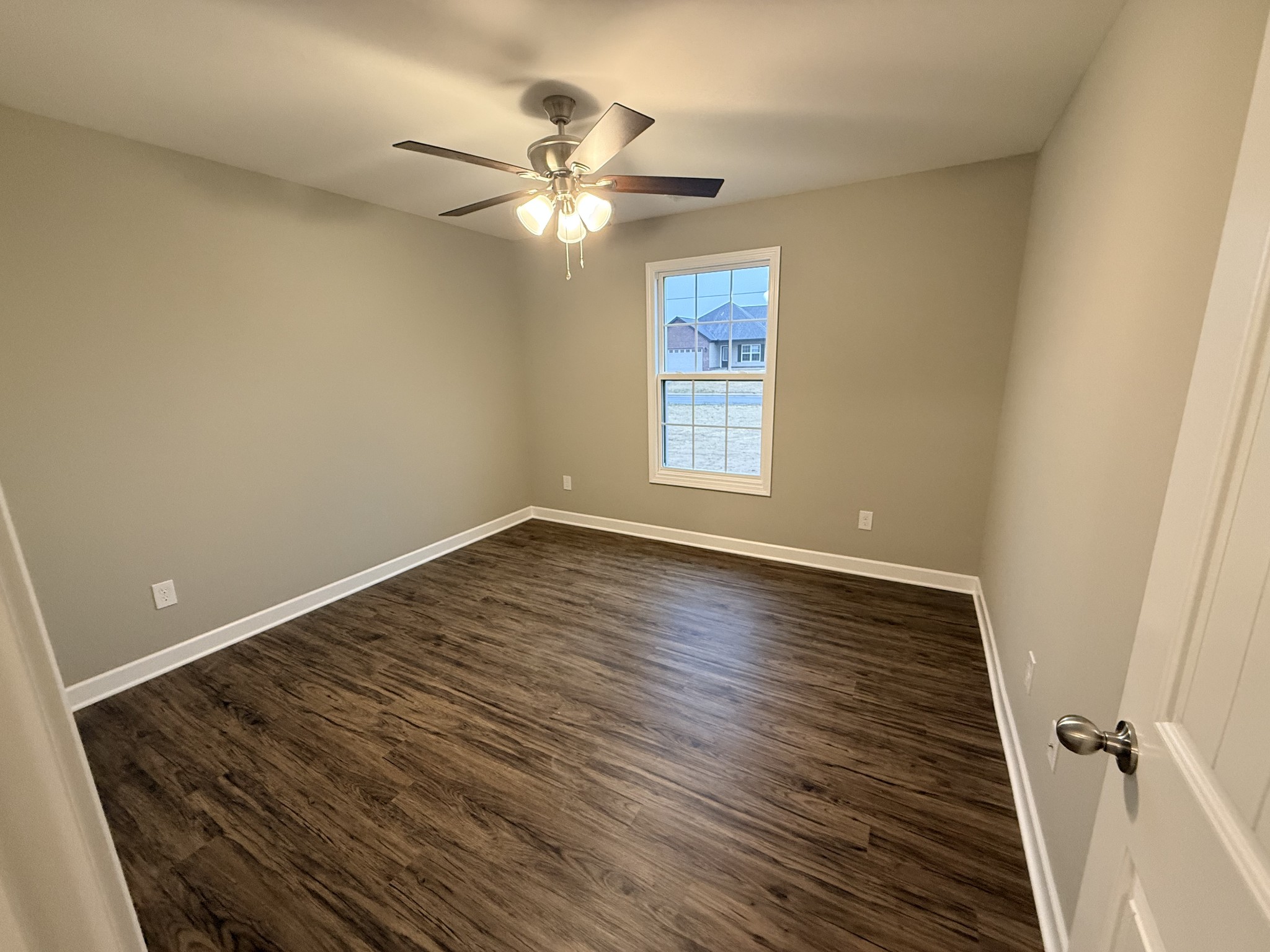 482 Ridge Street Manchester, TN 37355 - Photo 15 of 21 a view of an empty room with wooden floor and a window