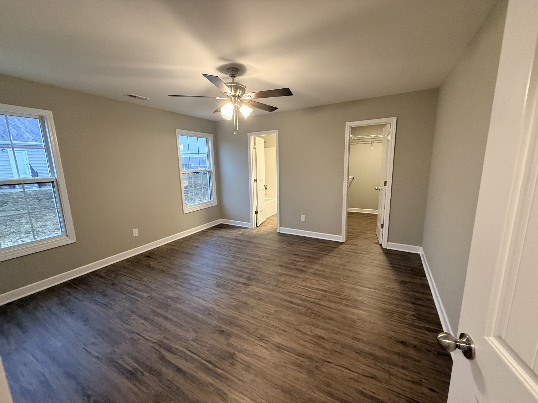 482 Ridge Street Manchester, TN 37355 - Photo 8 of 21 a view of an empty room with wooden floor and a window