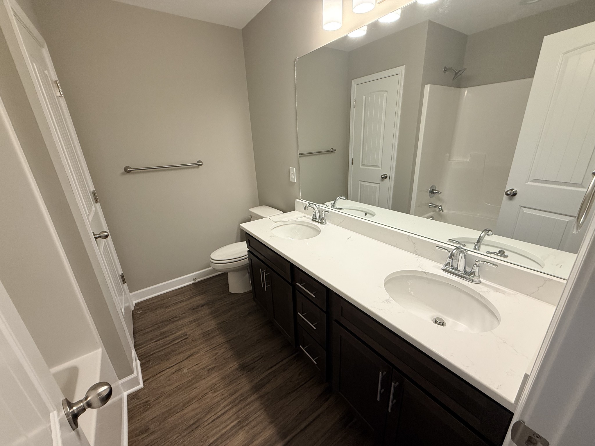 482 Ridge Street Manchester, TN 37355 - Photo 10 of 21 a bathroom with a double vanity sink and a mirror