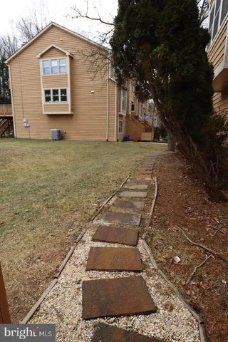 a view of a big house with a yard