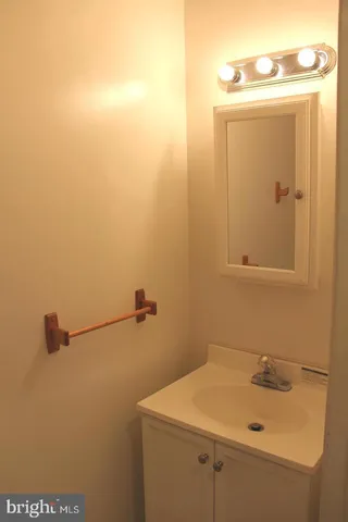 a bathroom with a sink and cabinets