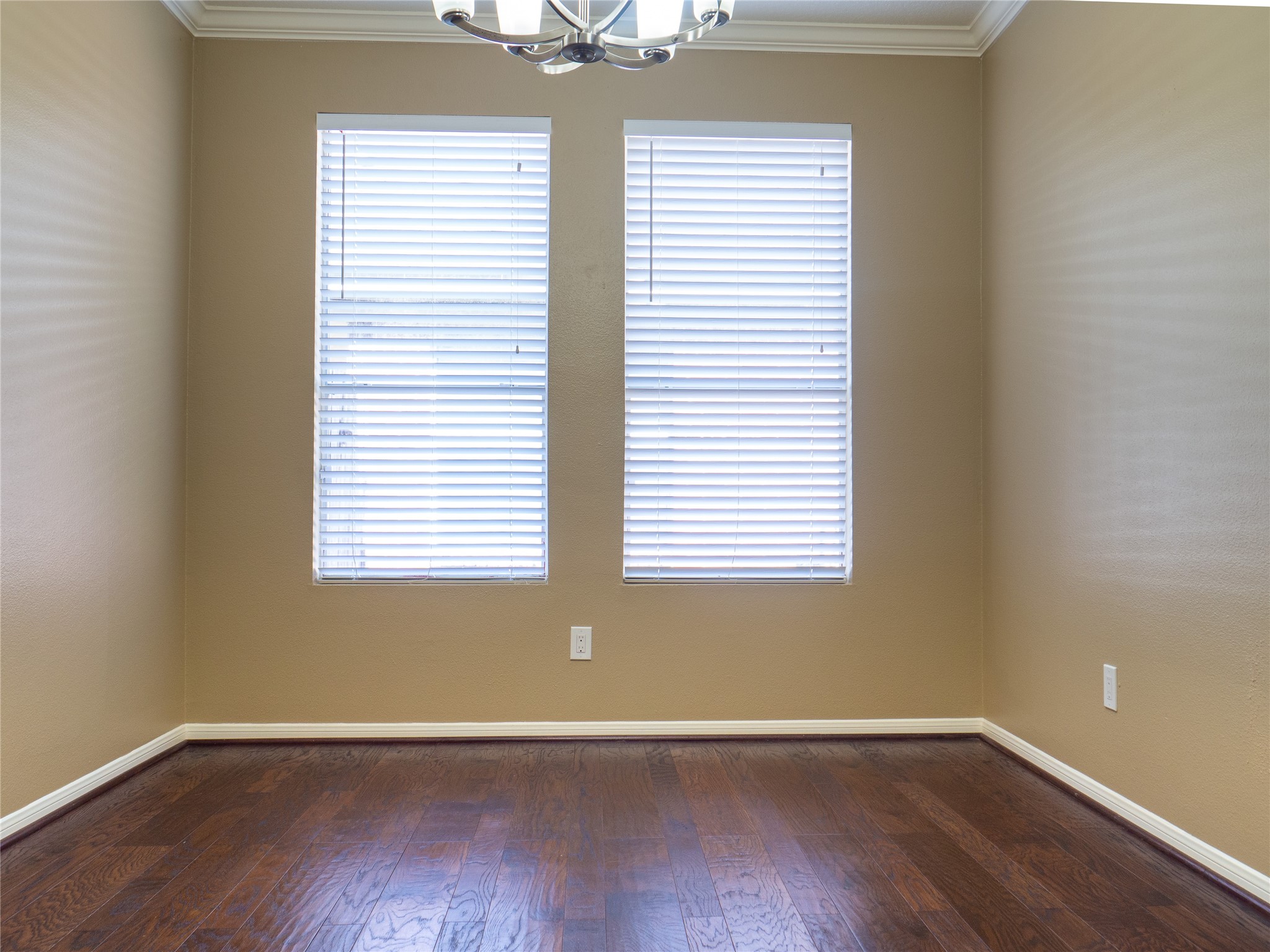 22527 Goss Spring Court Spring, TX 77373 - Photo 11 of 24 an empty room with wooden floor and windows