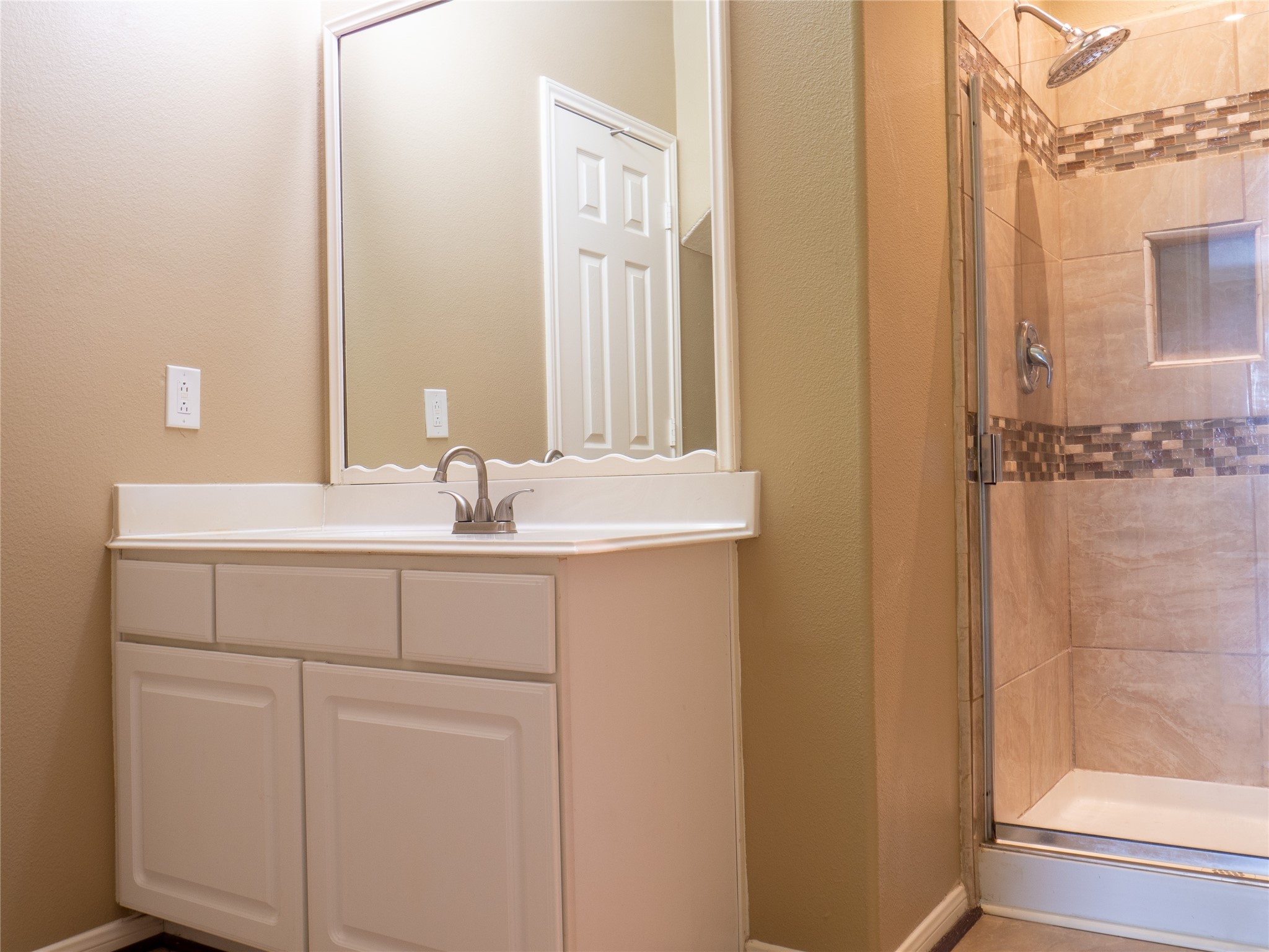 22527 Goss Spring Court Spring, TX 77373 - Photo 12 of 24 a bathroom with a sink and a mirror