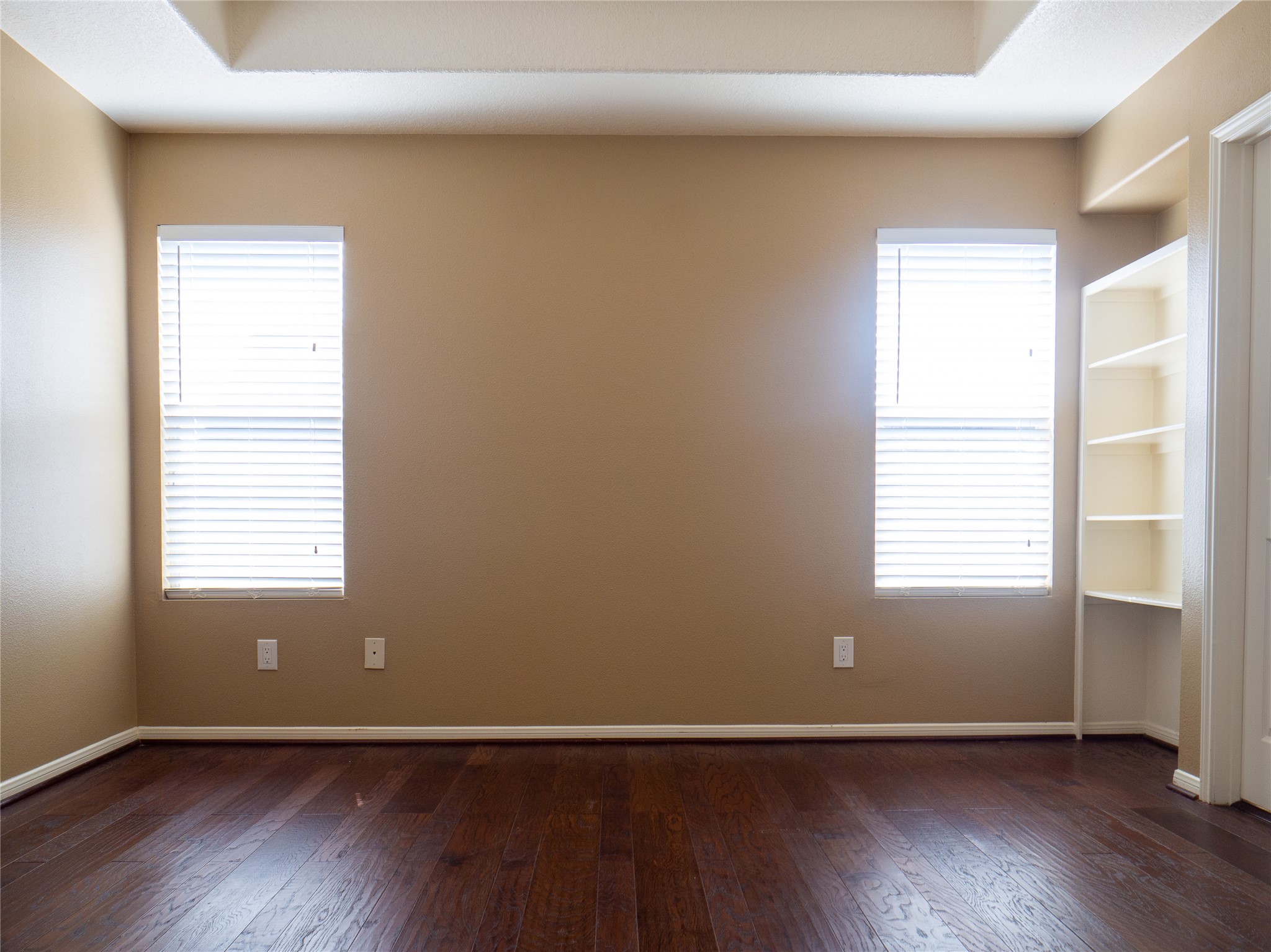 22527 Goss Spring Court Spring, TX 77373 - Photo 17 of 24 an empty room with wooden floor and windows