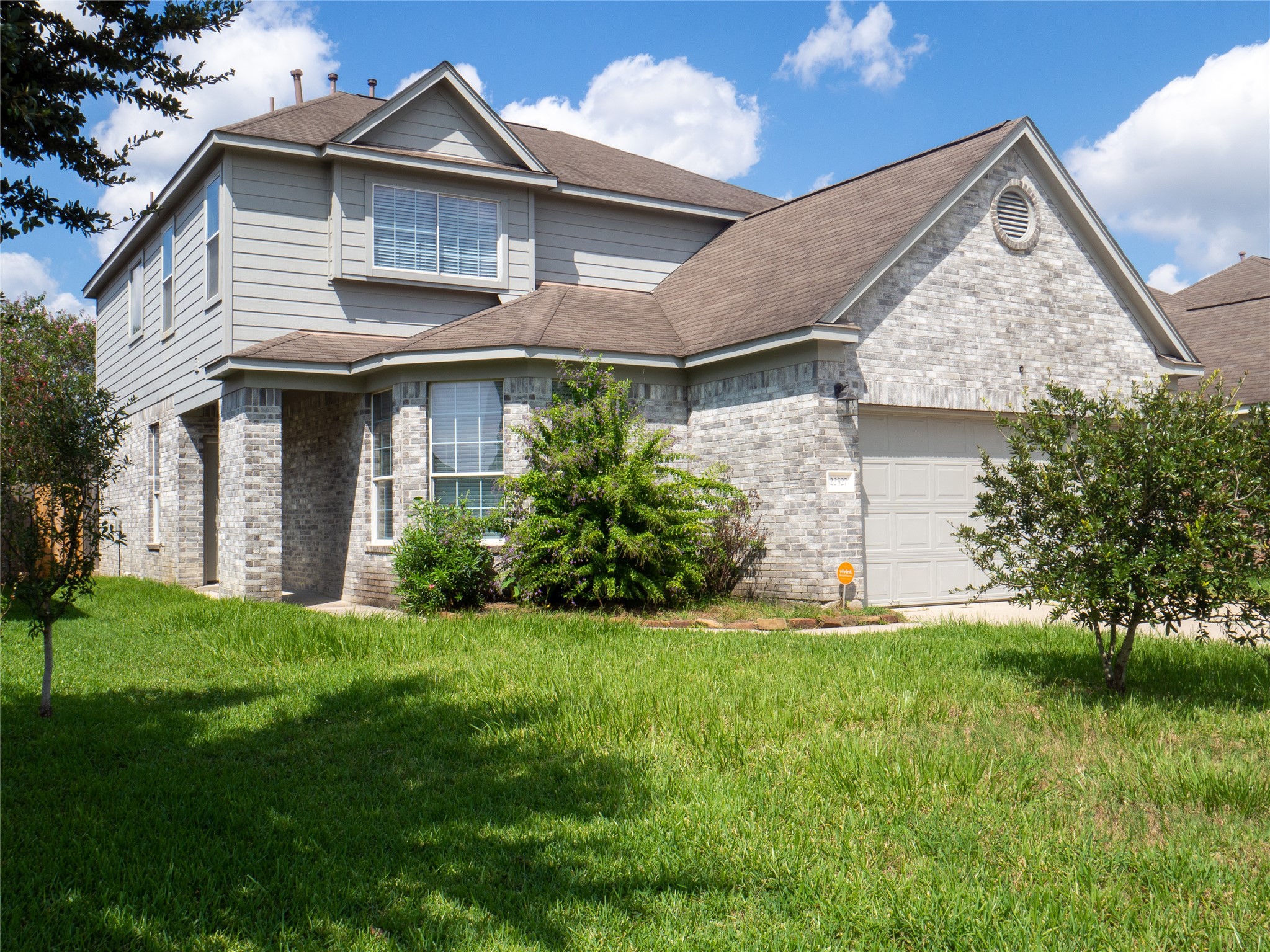 22527 Goss Spring Court Spring, TX 77373 - Photo 2 of 24 a view of a yard in front of a house with plants
