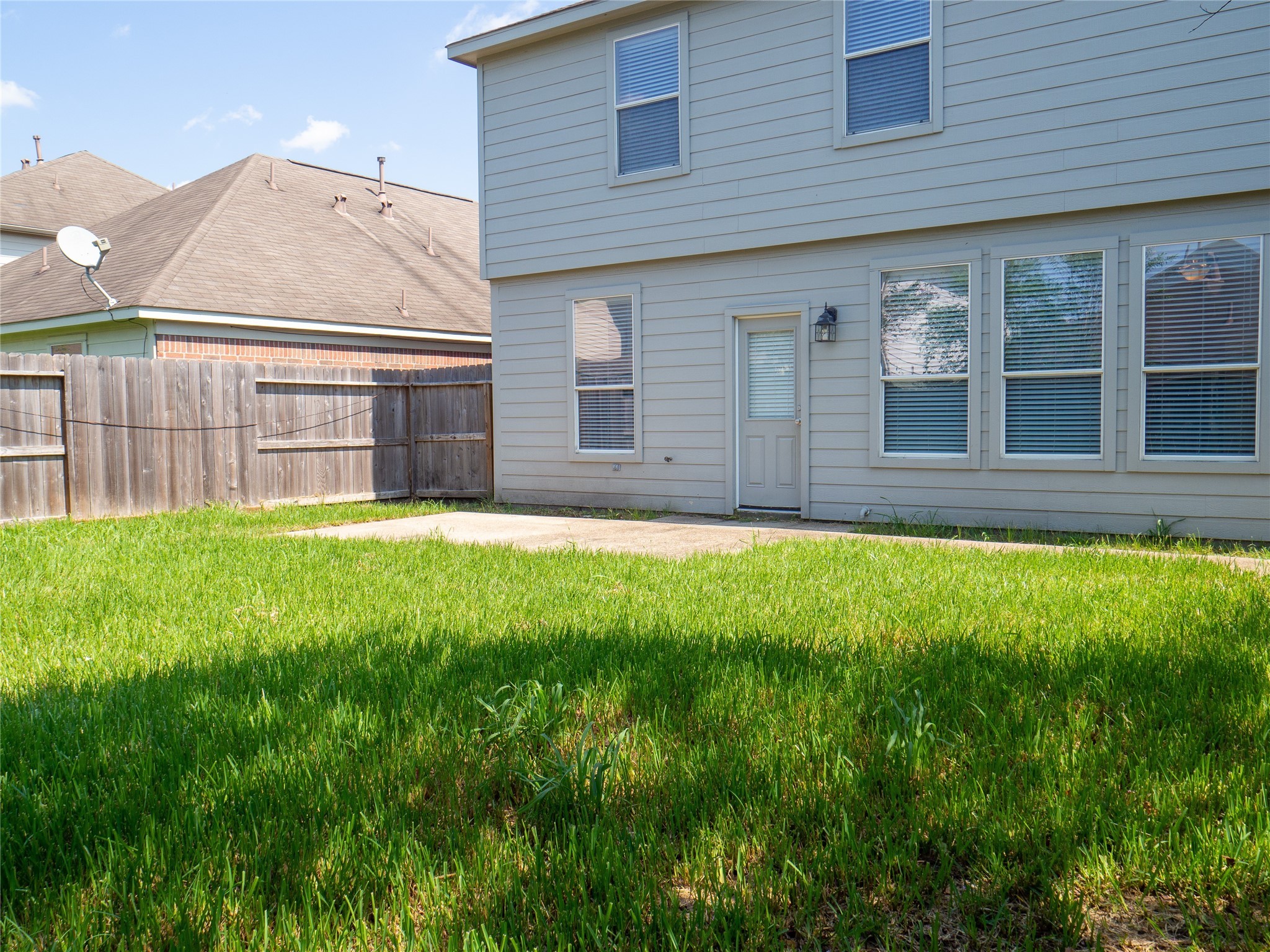 22527 Goss Spring Court Spring, TX 77373 - Photo 23 of 24 a view of house with backyard and a tub
