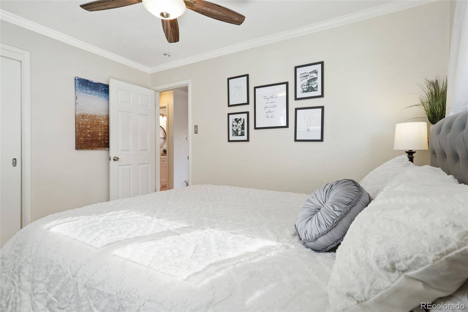 261 Inca Street Denver, CO 80223 - Photo 8 of 28 a bedroom with a bed and a window