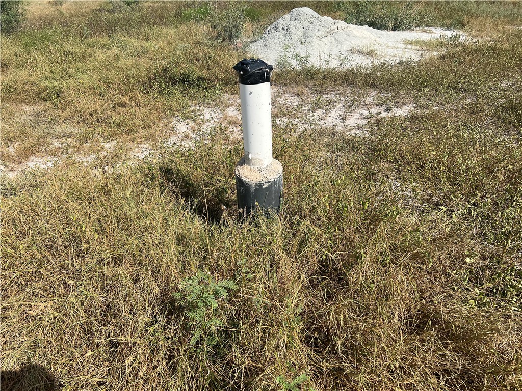 351 County Road 351 Mathis, TX 78368 - Photo 4 of 24 a fire hydrant in front of a white house