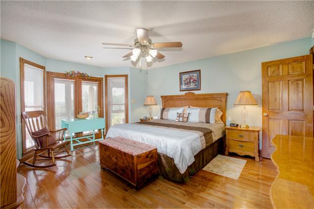 215 Carter Road Pulaski, TN 38478 - Photo 11 of 20 Master Bedroom - Featuring hardwood flooring, ceiling fan, bay window and walk-in closet.