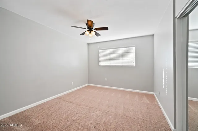 a view of empty room with windows