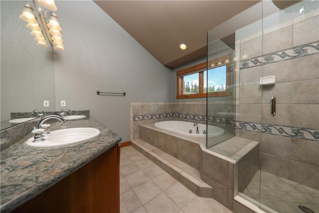 290 Elk Circle Keystone, CO 80435 - Photo 12 of 25 a spacious bathroom with a bathtub and a sink