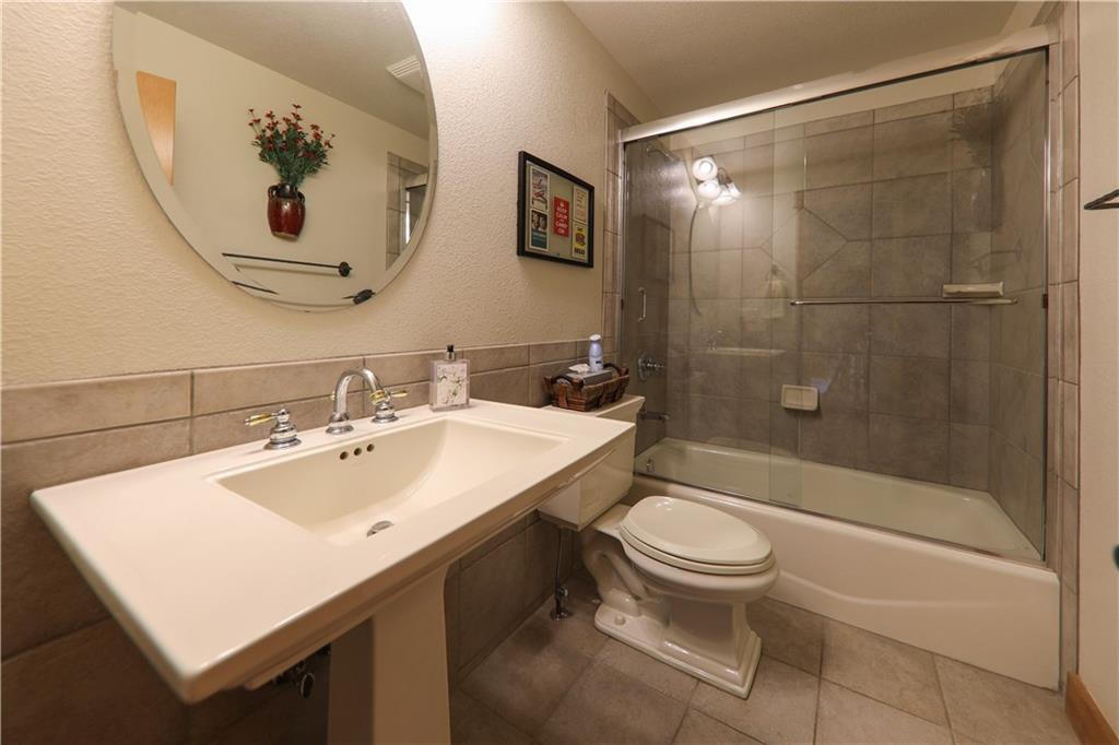290 Elk Circle Keystone, CO 80435 - Photo 13 of 25 a bathroom with a sink a toilet and shower