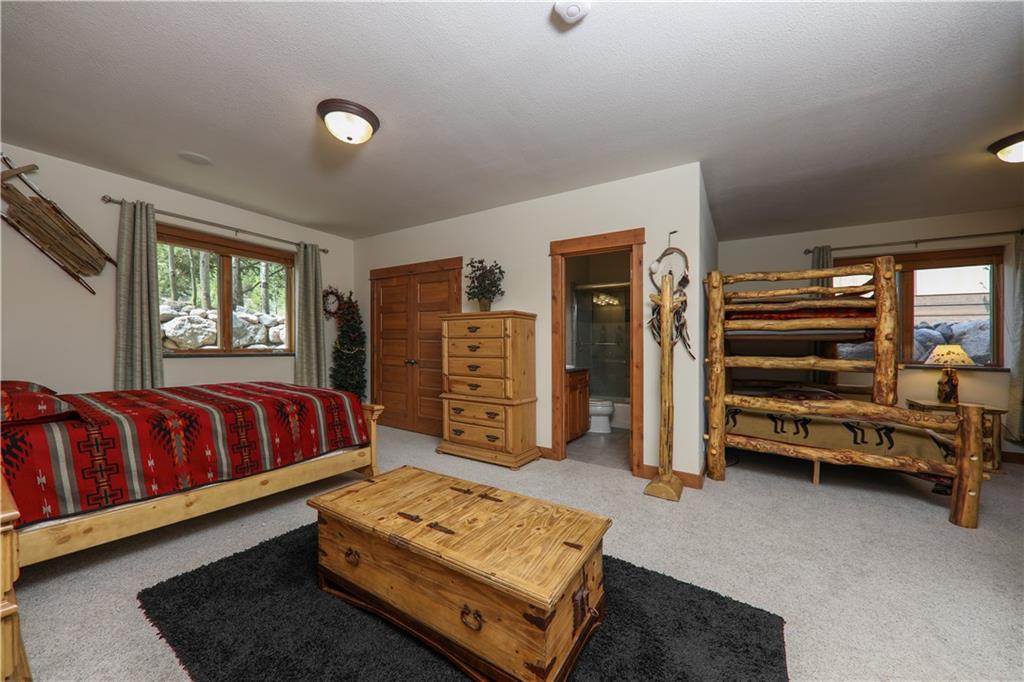 290 Elk Circle Keystone, CO 80435 - Photo 21 of 25 a bedroom with a bed and a window