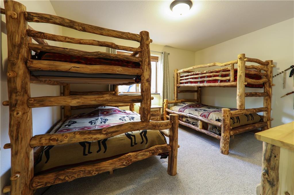 290 Elk Circle Keystone, CO 80435 - Photo 22 of 25 a bedroom with a bed and a tv