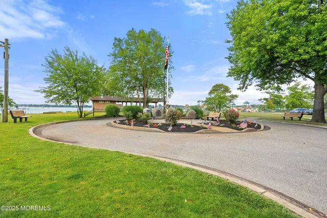a view of swimming pool with a dining table and a chairs