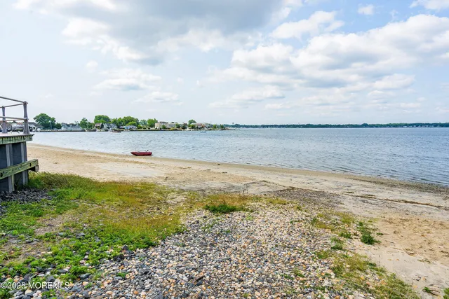 a view of a swimming pool with an outdoor seating and a yard