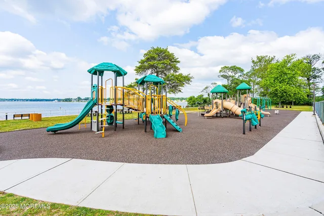 a childrens park with lots of swings and slides