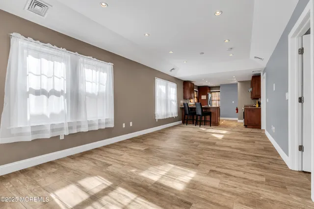 a view of livingroom with hardwood and furniture