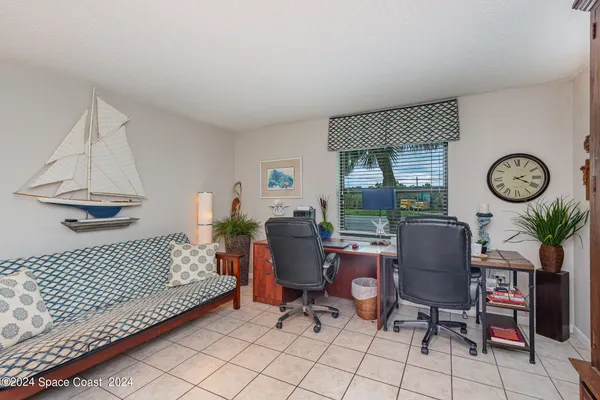 a bathroom with a granite countertop sink a mirror and a bathtub