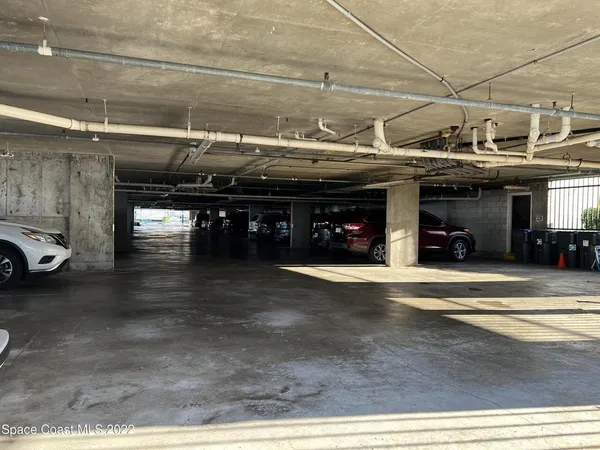 a view of a house with swimming pool and sitting area