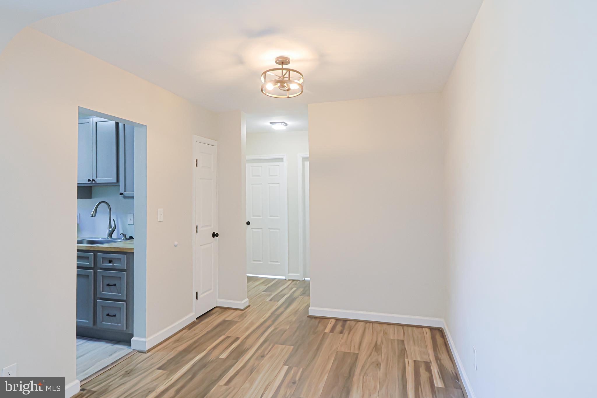 514 Ridge Road Southeast, Unit 311 Washington, DC 20019 - Photo 5 of 26 View of Dining Area/Hallway From Living Room