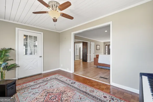 a kitchen with granite countertop white cabinets stainless steel appliances a sink and a window