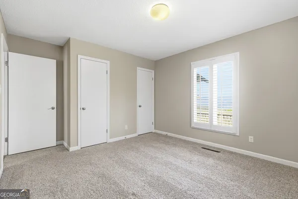 a bathroom with a bathtub shower sink and toilet
