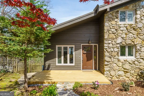 a front view of a house with a porch