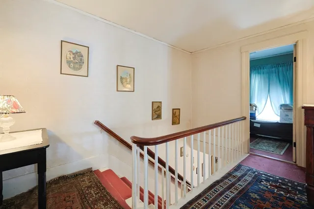 a bedroom with a bed and a dresser in it