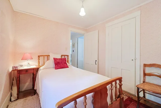 a bed room with a bed and a window