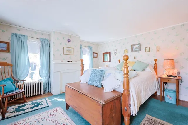 a bedroom with a bed and furniture