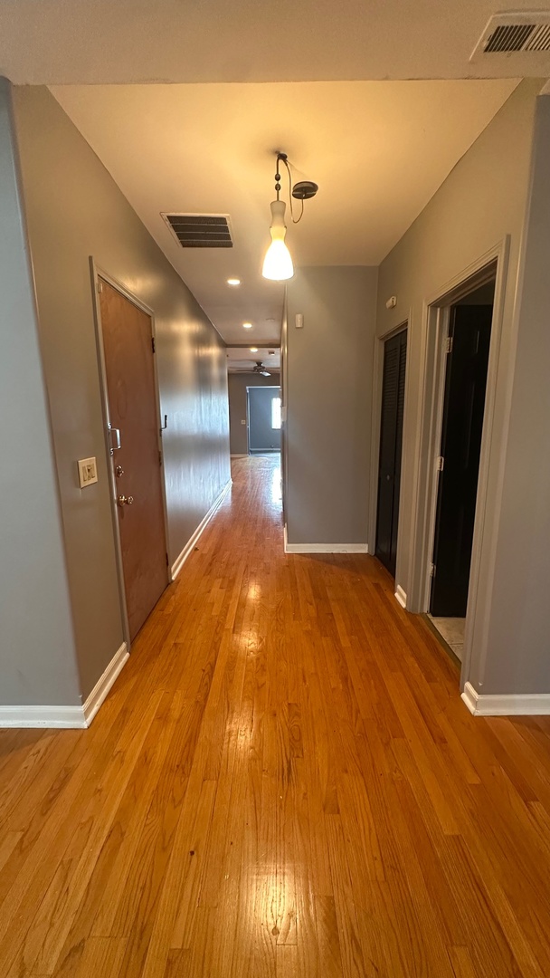 6714 South Chappel Avenue, Unit 2 Chicago, IL 60649 - Photo 4 of 10 a view of a room with wooden floor