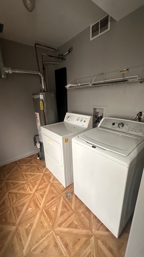 6714 South Chappel Avenue, Unit 2 Chicago, IL 60649 - Photo 10 of 10 a utility room with dryer and washer