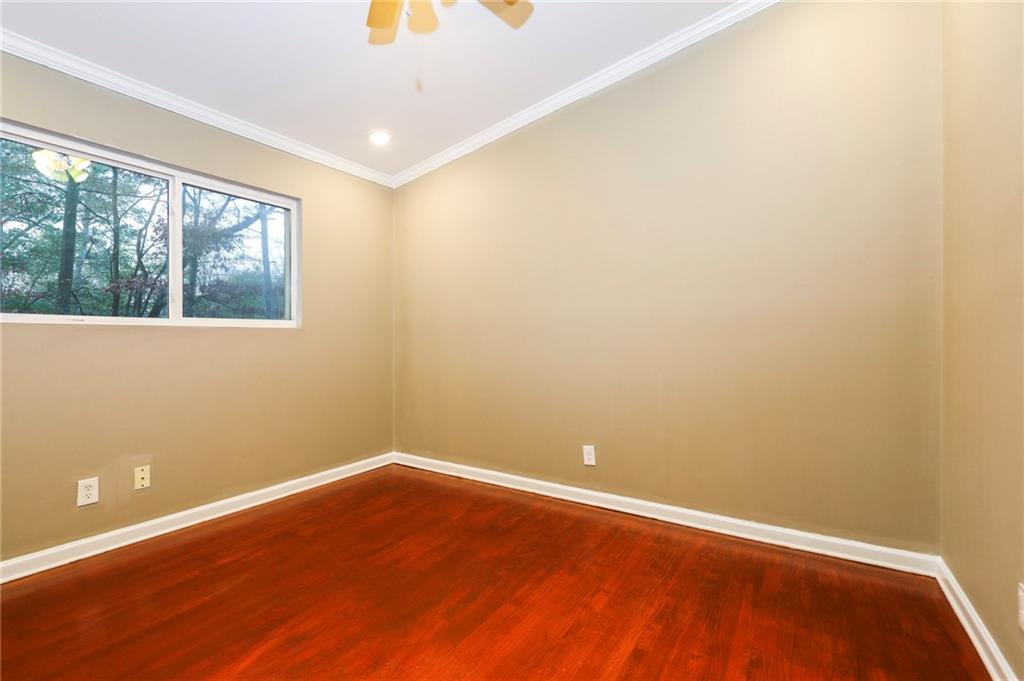 1277 Goodwin Road Northeast, Unit 1275 Atlanta, GA 30324 - Photo 11 of 19 an empty room with a window
